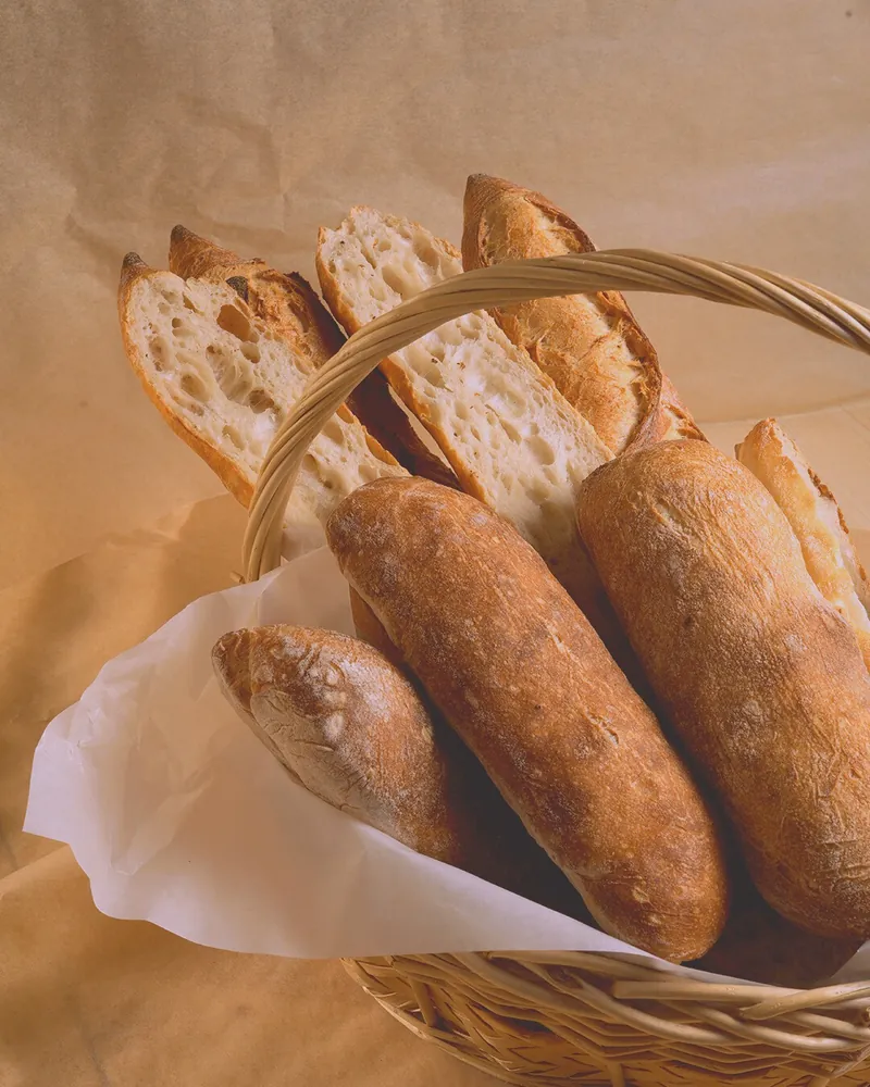 A basket full of fresh bread for the table